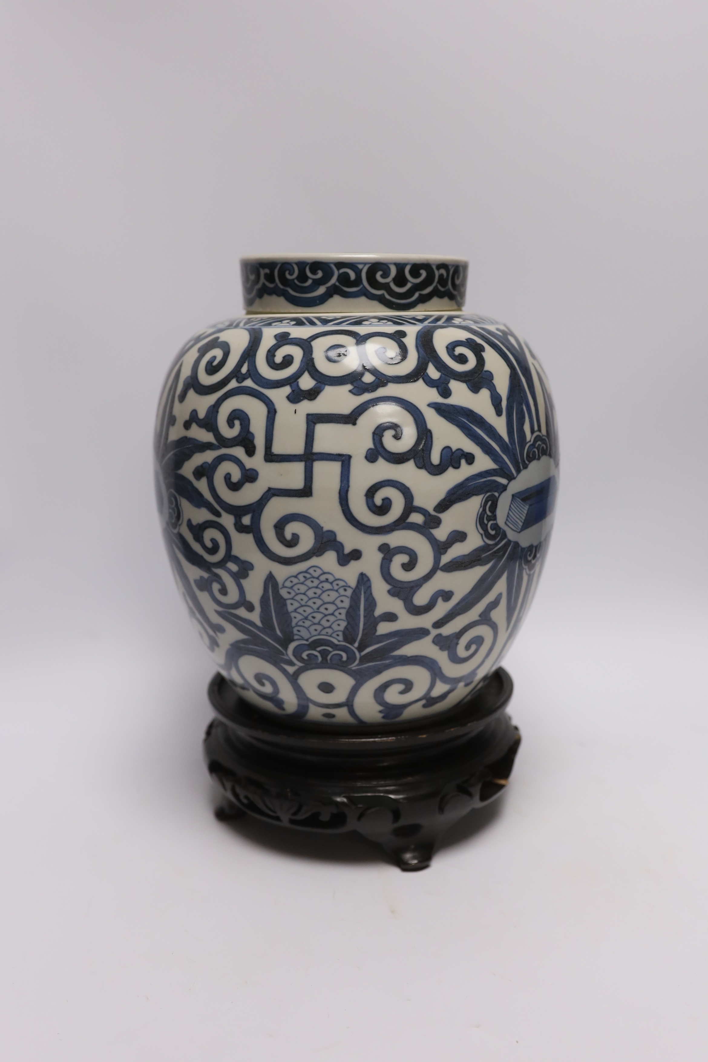 A 19th century Chinese blue and white jar and cover, with stand, 29cm total (including stand)